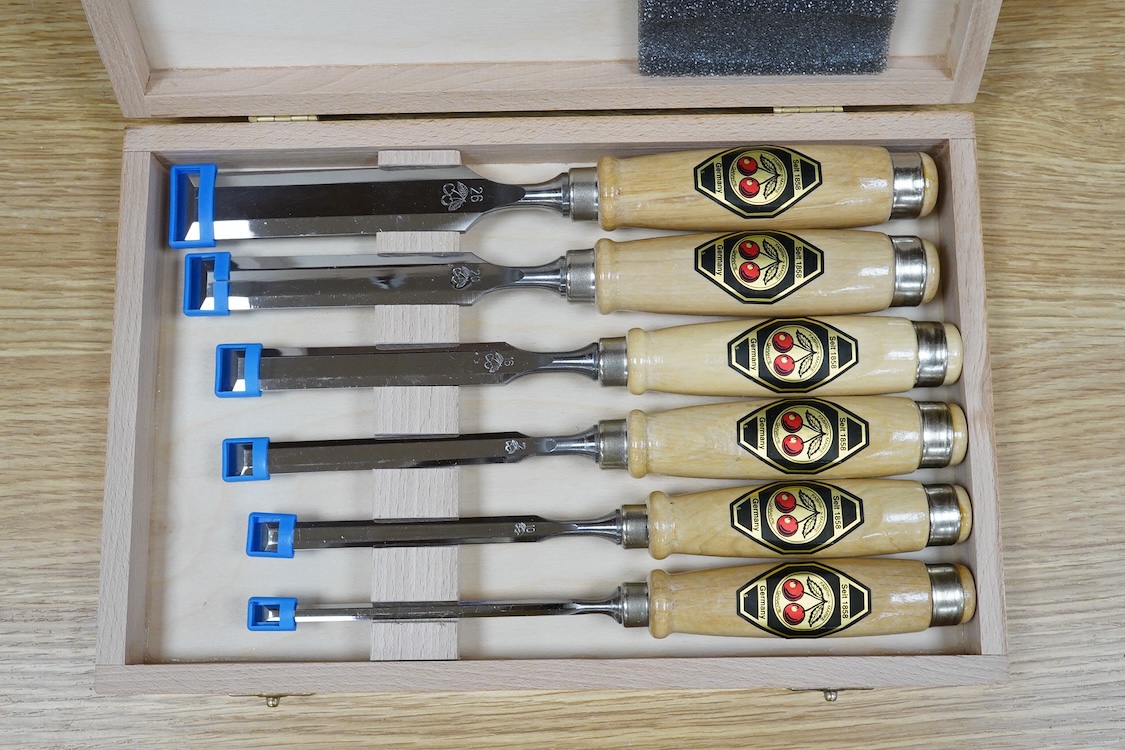 Three sets of woodworking chisels, including a cased six piece set by Seit, Germany, a nine piece set by Herschel, Germany, in a leather roll and a Swiss made nine piece set also in a leather roll